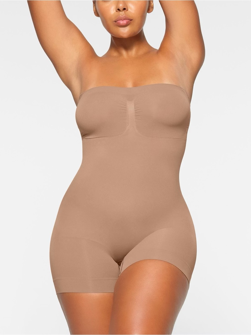 SKIMS Seamless Sculpt Strapless Shortie Bodysuits in Sienna